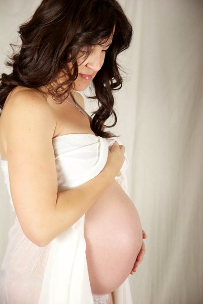 Pregnant woman looking down